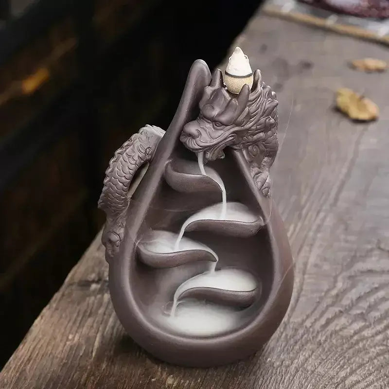 dragon incense burner, backflow incense holder, waterfall incense burner, ceramic incense burner, aromatherapy incense burner, backflow cone incense burner, relaxing incense holder, unique incense burner gift, home decor incense burner, incense burner for meditation, stress relief incense burner, decorative incense burner, incense burner with smoke waterfall, creative incense holder, incense burner for wellbeing