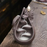 dragon incense burner, backflow incense holder, waterfall incense burner, ceramic incense burner, aromatherapy incense burner, backflow cone incense burner, relaxing incense holder, unique incense burner gift, home decor incense burner, incense burner for meditation, stress relief incense burner, decorative incense burner, incense burner with smoke waterfall, creative incense holder, incense burner for wellbeing

