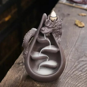 dragon incense burner, backflow incense holder, waterfall incense burner, ceramic incense burner, aromatherapy incense burner, backflow cone incense burner, relaxing incense holder, unique incense burner gift, home decor incense burner, incense burner for meditation, stress relief incense burner, decorative incense burner, incense burner with smoke waterfall, creative incense holder, incense burner for wellbeing

