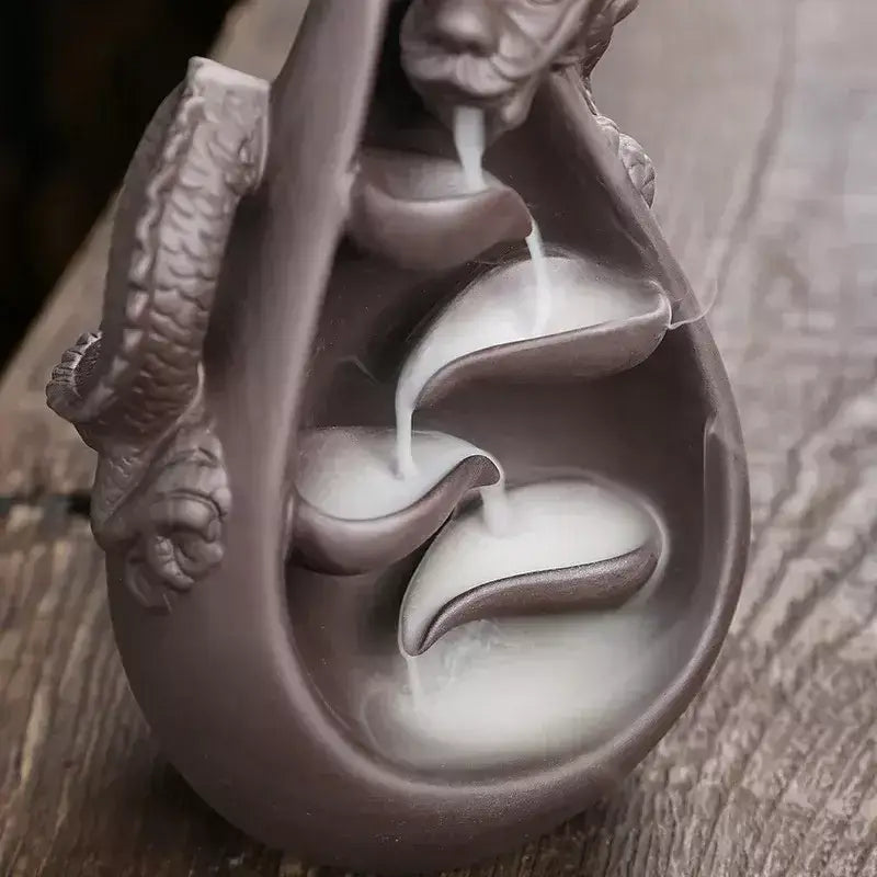 dragon incense burner, backflow incense holder, waterfall incense burner, ceramic incense burner, aromatherapy incense burner, backflow cone incense burner, relaxing incense holder, unique incense burner gift, home decor incense burner, incense burner for meditation, stress relief incense burner, decorative incense burner, incense burner with smoke waterfall, creative incense holder, incense burner for wellbeing
