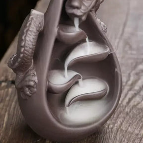 dragon incense burner, backflow incense holder, waterfall incense burner, ceramic incense burner, aromatherapy incense burner, backflow cone incense burner, relaxing incense holder, unique incense burner gift, home decor incense burner, incense burner for meditation, stress relief incense burner, decorative incense burner, incense burner with smoke waterfall, creative incense holder, incense burner for wellbeing
