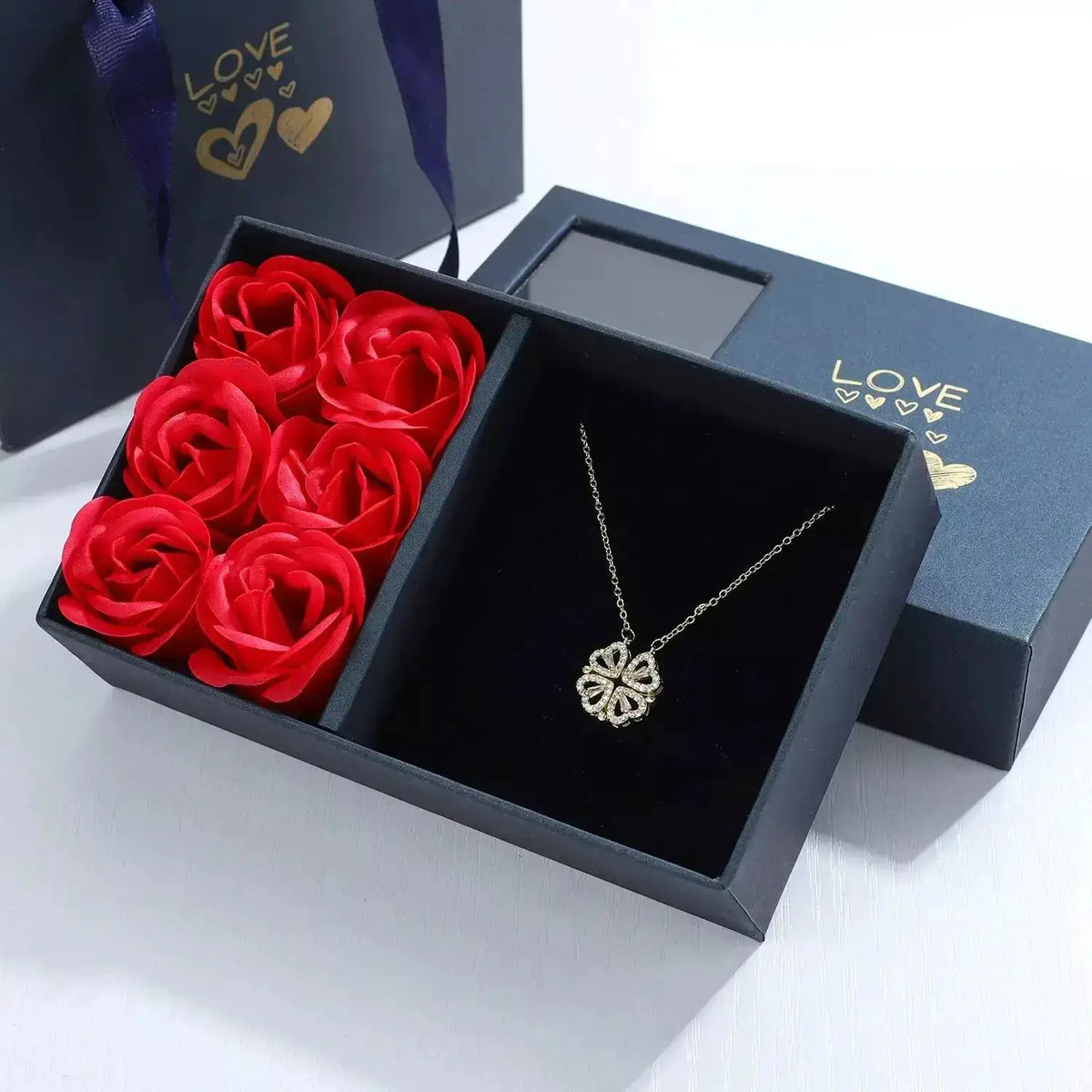 Magnetic Love Clover Necklace, Romantic necklace for couples, Couple’s magnetic necklace, Heart clover pendant necklace, Unisex romantic jewellery UK, Anniversary gift for her UK, Valentine’s Day gift UK, Meaningful gift for loved one, Symbolic love necklace, Gift box with roses necklace, Magnetic couple necklace UK, Love pendant necklace, Special occasion necklace, Romantic jewellery gift, Unique necklace for girlfriend, Eternal love necklace, Lucky clover necklace, Magnetic heart necklace