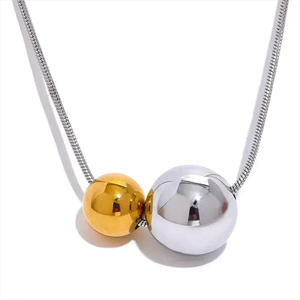 women’s necklace, sphere necklace, gold-plated necklace, elegant jewellery, modern necklace, sophisticated accessory, water-resistant necklace, gift for her, unisex necklace, minimalist necklace, stainless steel necklace, everyday necklace
