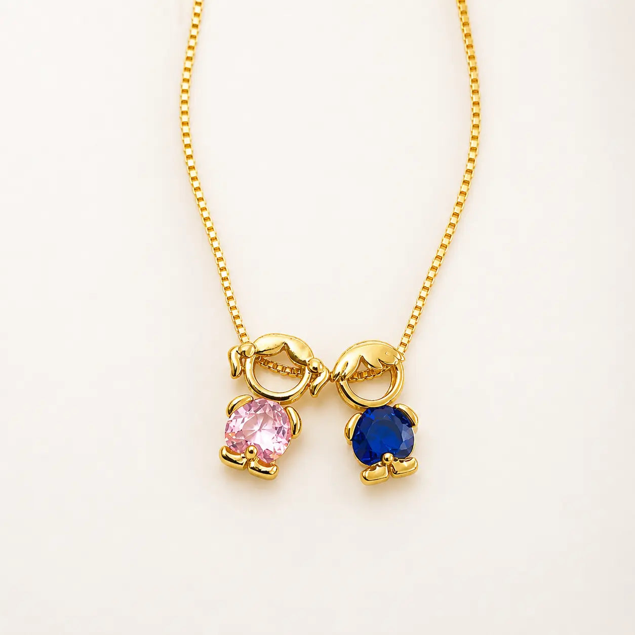 Mother & Child Love Necklace with a girl figure in pink stone and a boy figure in blue stone