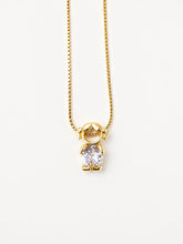 Gold-tone necklace with one girl figure pendant and a white stone