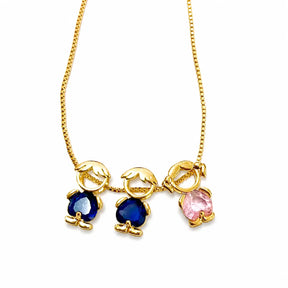 Gold-tone necklace with two boy figures in blue stones and one girl figure in pink stone