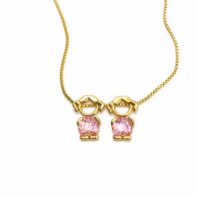Gold-tone necklace with two girl figure pendants and pink stones