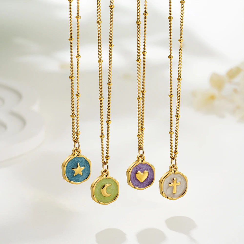 Celeste Talisman Necklace in four styles: star, moon, heart and cross enamel pendants