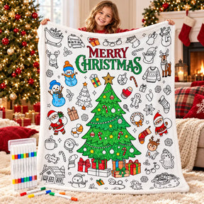 Girl holding up the part-coloured white Christmas colouring blanket, with the 24 fabric pens in their storage case beside her